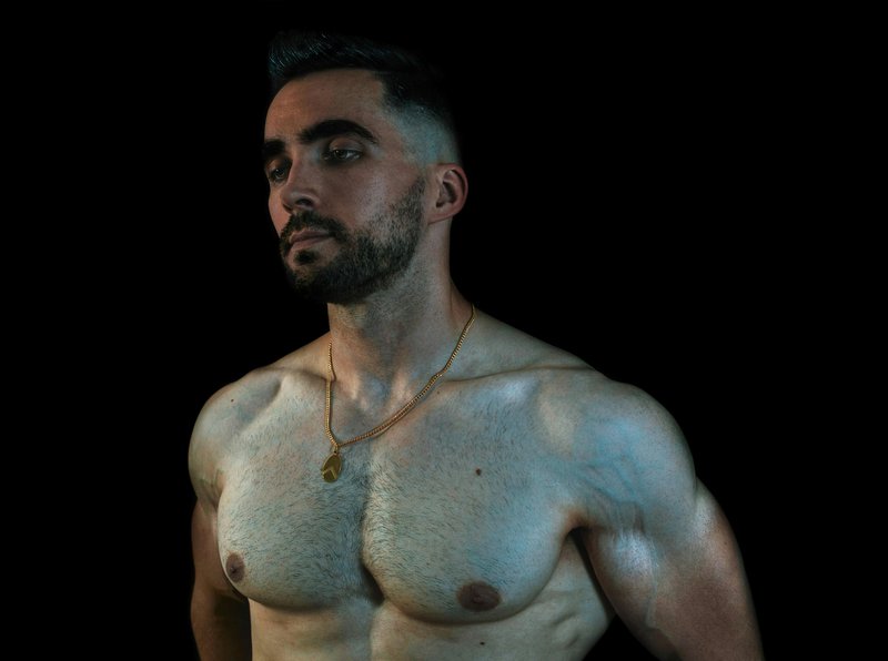 Lighting Muscles Men Trust to Look Ripped on Camera — No Filters Needed visual metaphor – confidence and energy